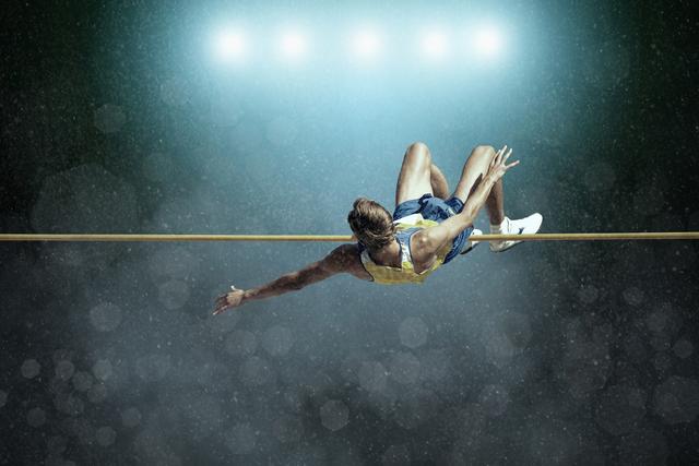 Athlete pole vaulter sprints over pole